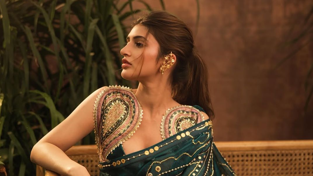 Sreeleela’s emerald-green sari comes with pearl embellishments and gold sequins