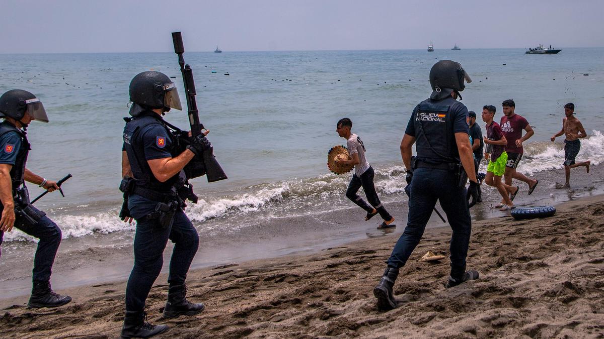 Spain deploys military to Ceuta after thousands of people breach Morocco’s border, at least nine die
