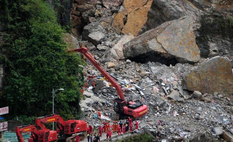 Rescuers race to find survivors in rain after landslip in China kills at least eight