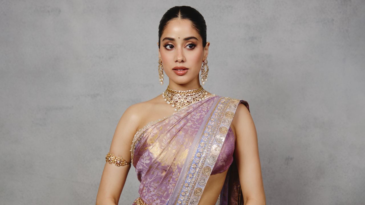 Janhvi Kapoor’s custom Manish Malhotra Banarasi sari is woven with shimmering gold foliage motifs