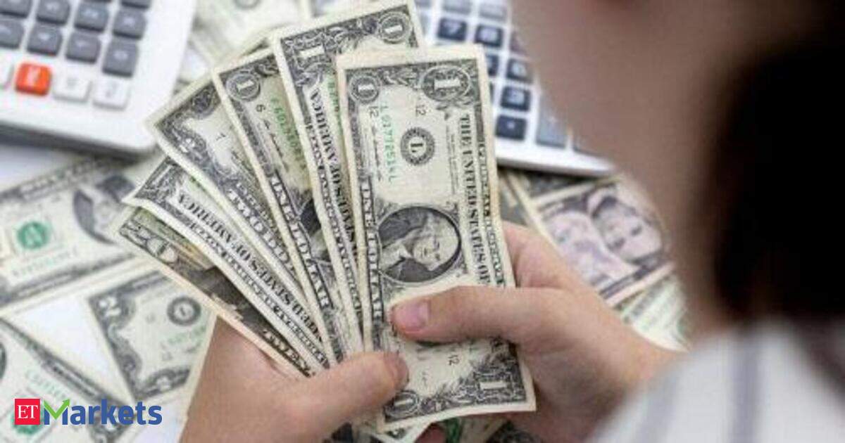 Dollar treads water as Fed hike bets pared on benign US inflation