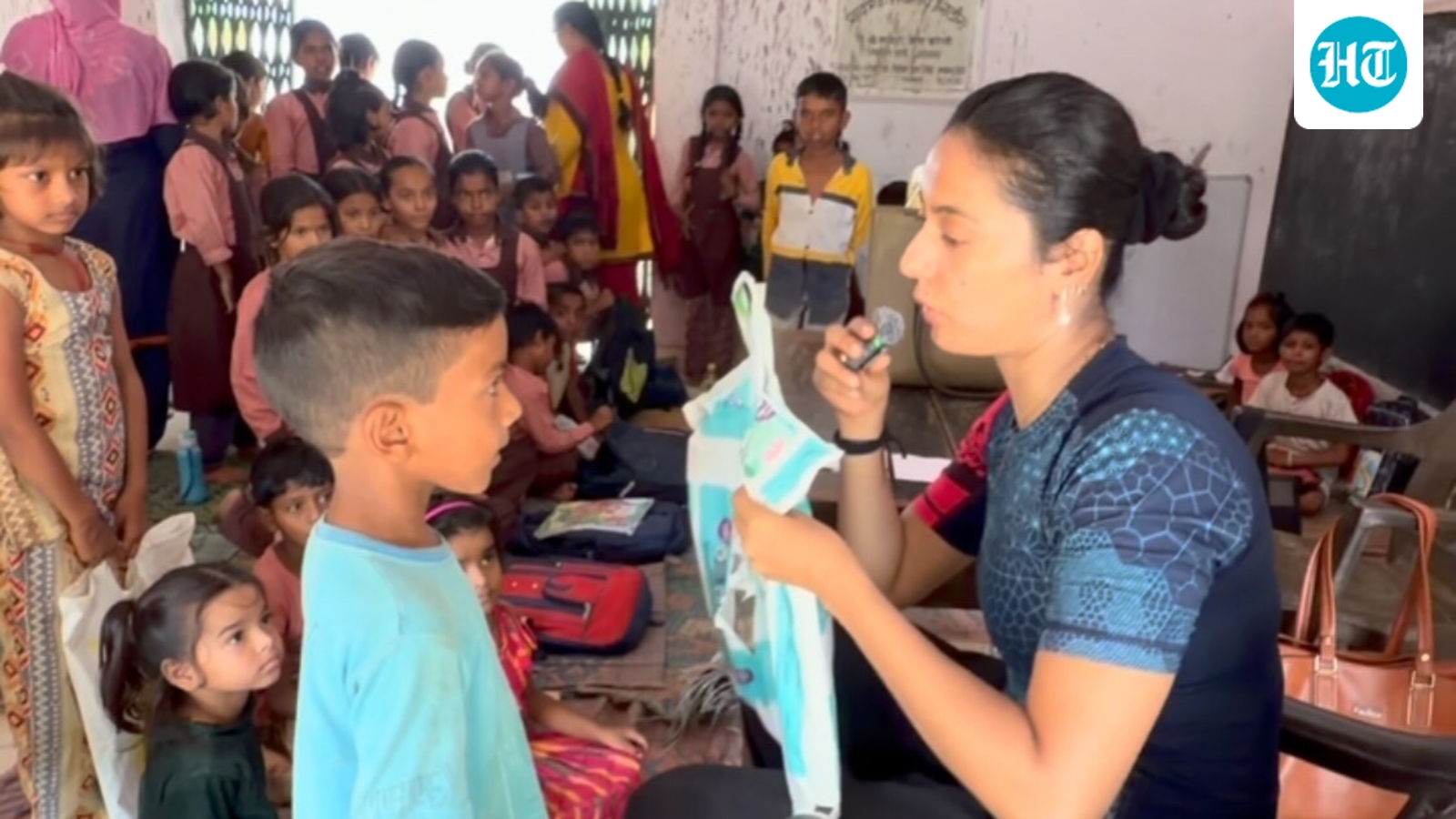 Govt school kids show Khushboo Patani their polythene school bags, she promises to bring them real ones. Watch