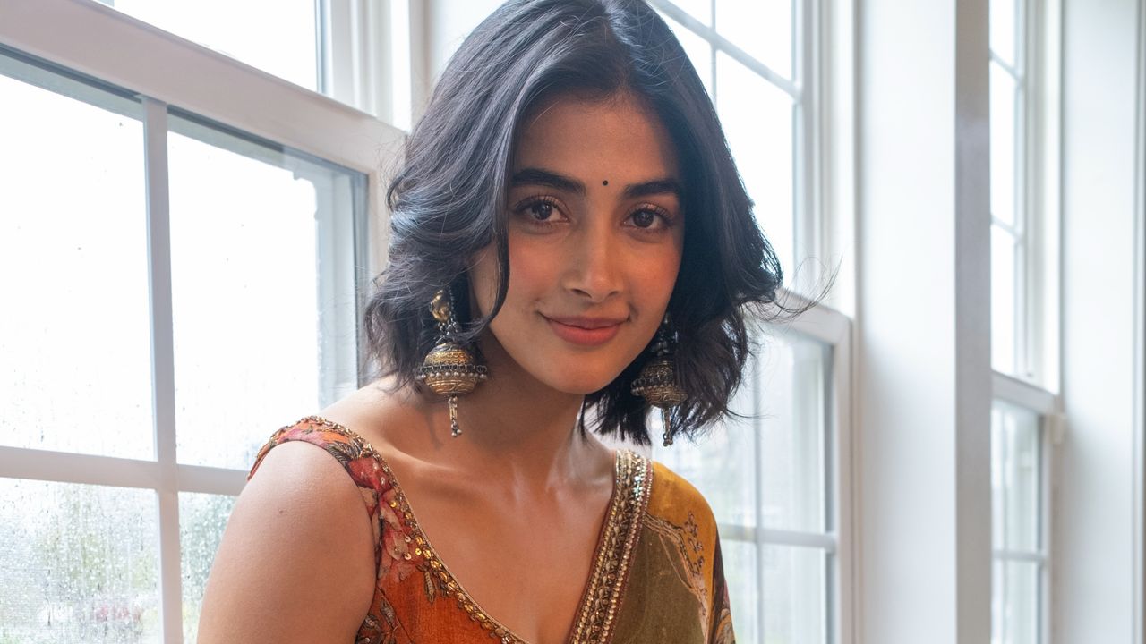 Pooja Hegde makes a case for dopamine dressing in a sari with vintage floral prints