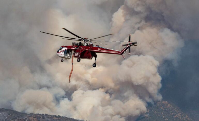 Dangerous wildfire keeps crews from reaching helicopter crash in Utah