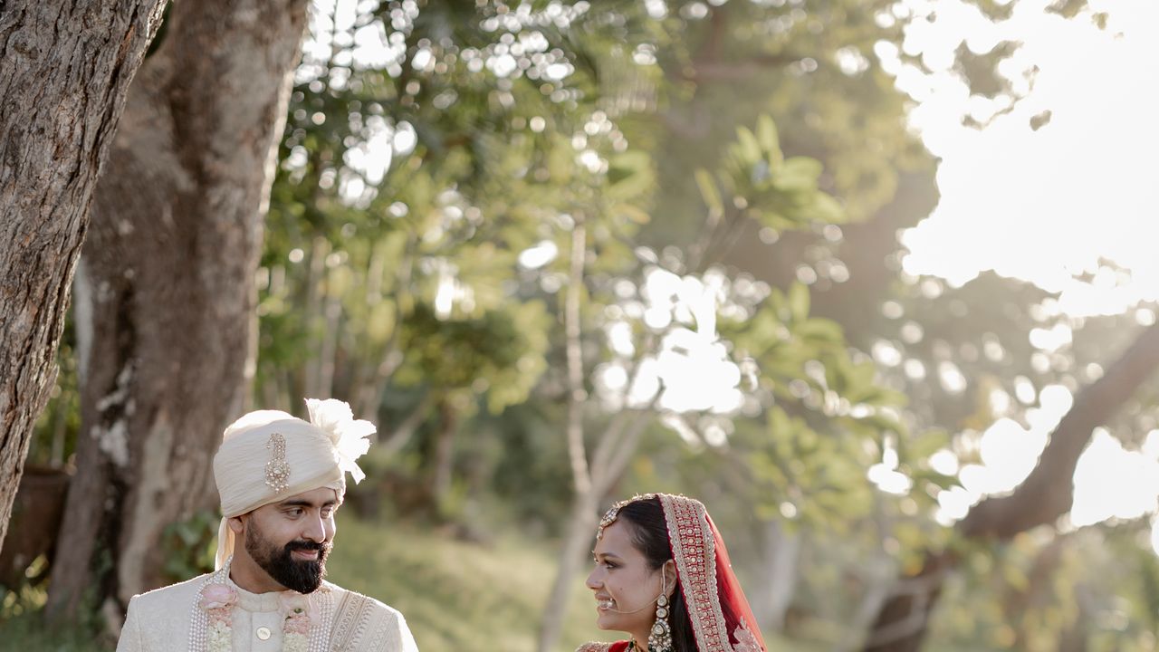 At their wedding in Bali, this couple took their pheras side by side and applied sindoor to each other