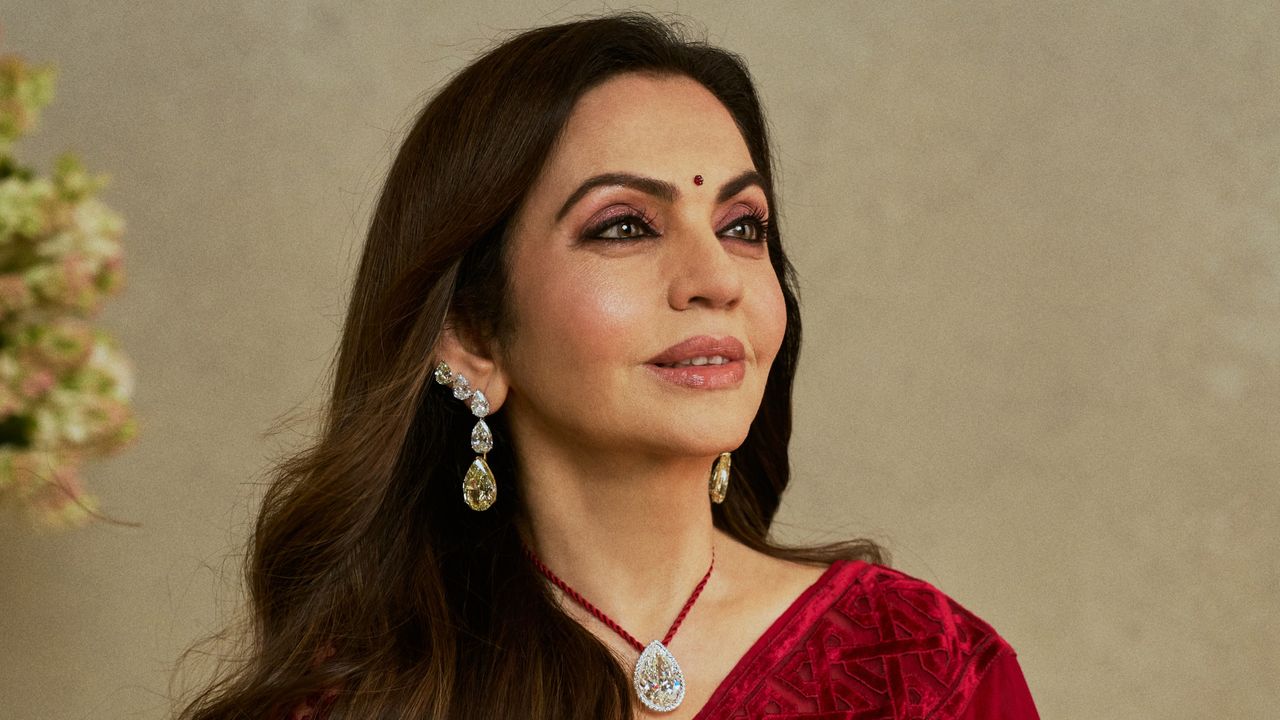 Nita Ambani wore a maroon Abu Jani Sandeep Khosla sari with an Art Deco-inspired geometric border